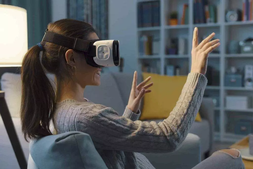 Woman Relaxing On The Sofa And Interacting With Virtual Reality.jpg